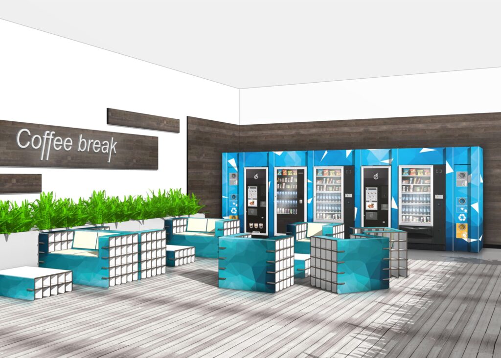 Table basse en carton écologique montée en design bleu et gris pour espaces de pause professionnels, intégration dans une zone Coffee break avec machines à boissons et distributeurs de produits, idéale pour les bureaux, open spaces ou stands événementiels scénographiés - Le Meuble en Carton une marque du groupe Natur Design