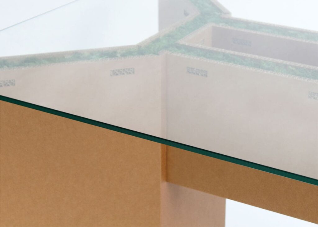 Détail d'une table de réunion en carton écologique pour 14 personnes, conçue pour les espaces professionnels et les salles de pause, avec structure solide et finition personnalisable - Le Meuble en Carton une marque du groupe Natur Design